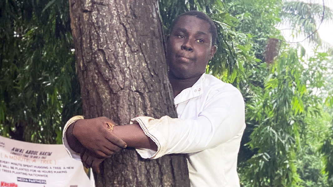 close-up-of-abdul-hugging-a-tree