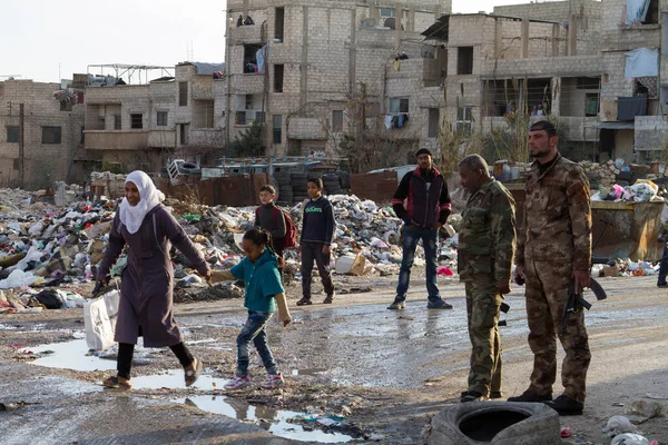 depositphotos_381578764-stock-photo-soldiers-civilians-douma-damascus