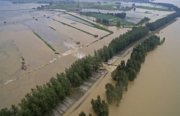 depositphotos_238080754-stock-photo-houses-farms-submerged-floods-caused